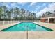 Large community pool with surrounding concrete deck and ample lounge seating at 931 Henry James Dr., Myrtle Beach, SC 29579