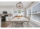 Dining area with modern chandelier and many windows for natural lighting at 931 Henry James Dr., Myrtle Beach, SC 29579