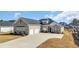 Charming brick home featuring an extra wide driveway and a 2-car garage at 931 Henry James Dr., Myrtle Beach, SC 29579