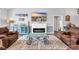 Inviting living room with a modern fireplace, hardwood floors, and stylish décor at 931 Henry James Dr., Myrtle Beach, SC 29579
