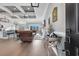 Open-concept living room with modern coffered ceilings and hardwood floors at 931 Henry James Dr., Myrtle Beach, SC 29579