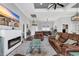 Bright living room featuring a fireplace and multiple seating areas for entertaining at 931 Henry James Dr., Myrtle Beach, SC 29579