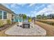 Outdoor patio with a modern fire pit, stylish furniture, and a view of the pool at 931 Henry James Dr., Myrtle Beach, SC 29579