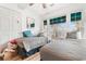 Bright bedroom with two twin beds, wood-look floors, and large windows at 9750 Leyland Dr. # 2, Myrtle Beach, SC 29572