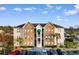 Exterior view of a multi-story building showcasing landscaping, and parking at 9750 Leyland Dr. # 2, Myrtle Beach, SC 29572