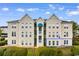 Exterior view of a multi-story building with manicured landscaping at 9750 Leyland Dr. # 2, Myrtle Beach, SC 29572