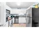 Clean kitchen featuring stainless steel appliances, granite counters, and white cabinetry at 9750 Leyland Dr. # 2, Myrtle Beach, SC 29572