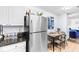 Kitchen featuring stainless steel refrigerator and a dining area with a table and four chairs at 9750 Leyland Dr. # 2, Myrtle Beach, SC 29572