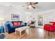 Bright living room with coastal decor, wood flooring, and comfortable seating at 9750 Leyland Dr. # 2, Myrtle Beach, SC 29572