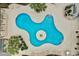 Aerial shot of the uniquely shaped community pool with plenty of room for residents to sunbathe and lounge at 9750 Leyland Dr. # 2, Myrtle Beach, SC 29572