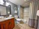 Neat bathroom with vanity, granite countertop, and coordinated shower curtain, and fluffy towels at 9820 Queensway Blvd. # 109, Myrtle Beach, SC 29572