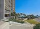 An inviting outdoor area showing the pool, palm trees, and ocean views, adding to the beach atmosphere at 9820 Queensway Blvd. # 109, Myrtle Beach, SC 29572