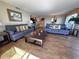 Inviting living room featuring two couches and a glimpse of the kitchen at 9820 Queensway Blvd. # 109, Myrtle Beach, SC 29572