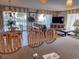 Open living space boasts an eat-in kitchen and sliding doors with beach views at 9820 Queensway Blvd. # 109, Myrtle Beach, SC 29572