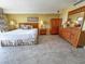 Spacious main bedroom features large window with ocean view, neutral walls, and wood furnishings at 9820 Queensway Blvd. # 109, Myrtle Beach, SC 29572