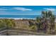 Beautiful ocean view from a boardwalk framed by lush vegetation at 9820 Queensway Blvd. # 109, Myrtle Beach, SC 29572