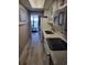 Efficient kitchen with white appliances and cabinetry, complemented by a view towards the ocean at 1501 S Ocean Blvd. S # 1041, Myrtle Beach, SC 29577