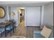 Living space with a Murphy bed, dining table, and a kitchen view, offering flexibility and comfort at 1501 S Ocean Blvd. S # 1041, Myrtle Beach, SC 29577