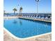 Refreshing outdoor pool with lounge chairs and palm trees overlooking the ocean at S Ocean Blvd. S # 1041, Myrtle Beach, SC 29577