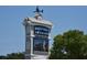 Sign for Barefoot Landing with a sailboat weathervane on top and a digital display at 1013 Jase Dr., Longs, SC 29568