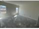 Bedroom with two windows, offering plenty of natural light and neighborhood views at 1013 Jase Dr., Longs, SC 29568