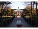 Classic brick building with white columns and manicured grounds viewed from a bridge at 1013 Jase Dr., Longs, SC 29568