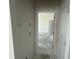 Hallway leading to additional rooms, showcasing the home's layout at 1013 Jase Dr., Longs, SC 29568