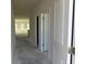 Bright hallway showcasing access to various rooms with natural light and neutral color palette at 1013 Jase Dr., Longs, SC 29568