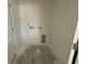 Interior view of a compact laundry room with connections and ample wall space at 1013 Jase Dr., Longs, SC 29568