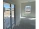 Bright living room with sliding glass doors offering backyard views and natural light at 1013 Jase Dr., Longs, SC 29568