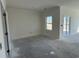 Bright Living Room showing large windows and a sliding door for natural light and access to outdoor space at 1013 Jase Dr., Longs, SC 29568