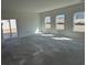 Spacious living room with sliding glass door and large windows offering plenty of natural light at 1013 Jase Dr., Longs, SC 29568