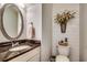 Stylish half-bathroom featuring granite countertop, decorative mirror, and shiplap accent wall at 1045 Means Circle, Myrtle Beach, SC 29577