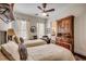 Bedroom featuring two twin beds, wooden cabinet, and neutral color palette at 1045 Means Circle, Myrtle Beach, SC 29577