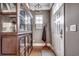 Inviting entryway with hardwood floors, coat rack, rug, and large wooden display case at 1045 Means Circle, Myrtle Beach, SC 29577