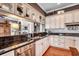 Well-lit kitchen featuring granite countertops, white cabinets, and stainless steel appliances at 1045 Means Circle, Myrtle Beach, SC 29577