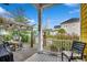 View from covered patio area of a brick patio with dining table, chairs and a wooden pergola at 1045 Means Circle, Myrtle Beach, SC 29577