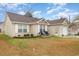 Charming home with cozy front porch, manicured garden beds, and attached garage at 105 Sebring Ln., Myrtle Beach, SC 29588