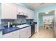 Stylish kitchen with blue countertops, a tile backsplash, and white cabinets at 105 Sebring Ln., Myrtle Beach, SC 29588