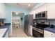 Modern kitchen with stainless steel appliances, ample counter space, and white cabinets at 105 Sebring Ln., Myrtle Beach, SC 29588