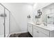 Well-lit bathroom with dual sink vanity, walk-in shower, and modern fixtures at 1061 Sennema Circle, Myrtle Beach, SC 29588