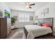 Bright bedroom with wood-look flooring, large window, and comfortable furnishings at 1061 Sennema Circle, Myrtle Beach, SC 29588