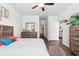 Spacious bedroom with ensuite bath features wood-look flooring and neutral decor at 1061 Sennema Circle, Myrtle Beach, SC 29588