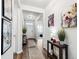 Stylish foyer features wood flooring, decorative tables, and a bright, welcoming ambiance at 1061 Sennema Circle, Myrtle Beach, SC 29588