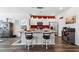 Bright kitchen island with granite countertops and seating for two with a red accent wall at 1061 Sennema Circle, Myrtle Beach, SC 29588