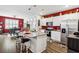 Modern kitchen with granite countertops, stainless steel appliances, an island, and adjacent dining area at 1061 Sennema Circle, Myrtle Beach, SC 29588