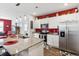 Modern kitchen with stainless steel appliances, granite countertops, white cabinets, and stylish backsplash at 1061 Sennema Circle, Myrtle Beach, SC 29588