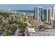 Beautiful aerial view of a coastal city featuring high-rise buildings, lush trees, and the ocean at 107 S Ocean Blvd. # 1706, Myrtle Beach, SC 29577