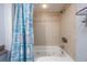 Tiled bathtub with seashell print shower curtain and jacuzzi jets at 107 S Ocean Blvd. # 1706, Myrtle Beach, SC 29577