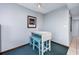 Casual dining area with white table, four blue stools, and striped rug at 107 S Ocean Blvd. # 1706, Myrtle Beach, SC 29577